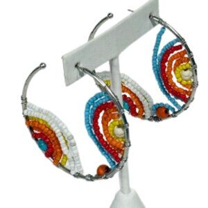 Silver-tone and beaded hoop earrings.